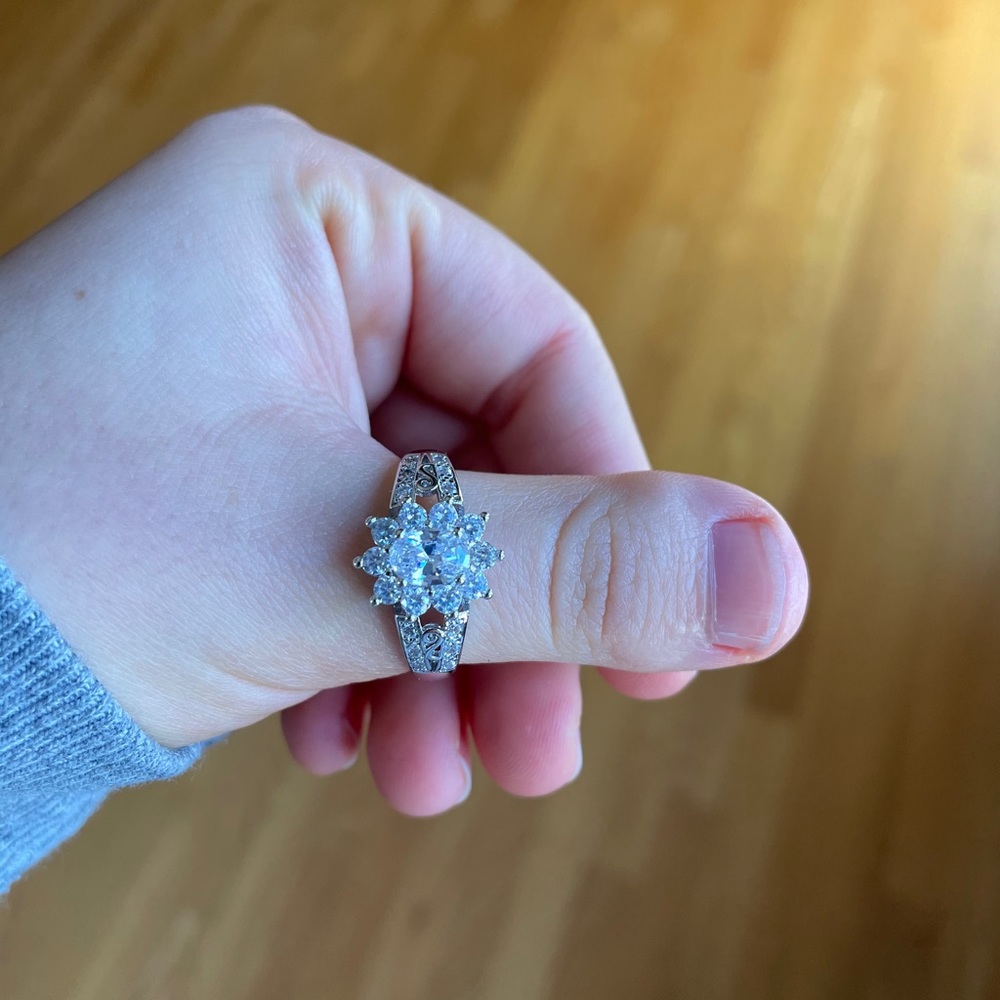Size 10 silver like material ring. Brand new